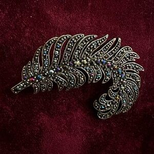 Elegant Black Feather Brooch with Multicolor Accents